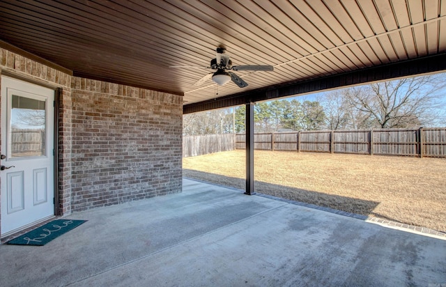 view of patio with a fenced backyard and a ceiling fan