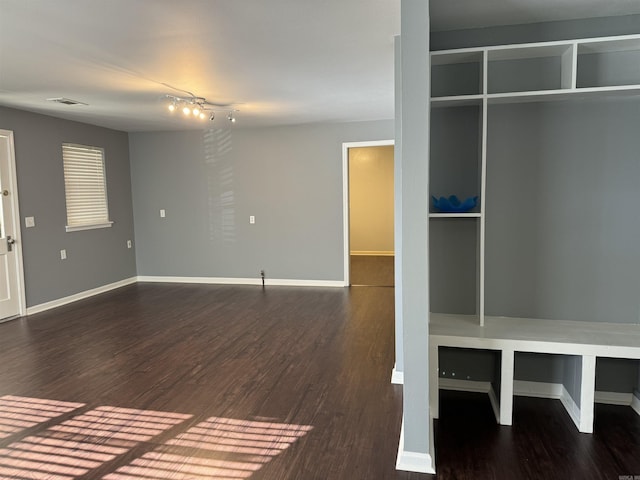 mudroom with baseboards and wood finished floors