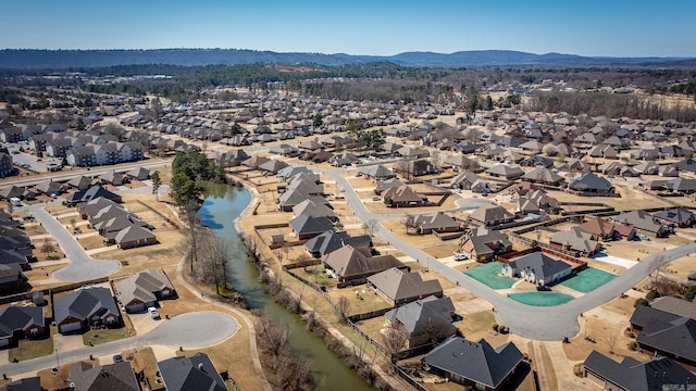 birds eye view of property featuring a residential view and a water and mountain view