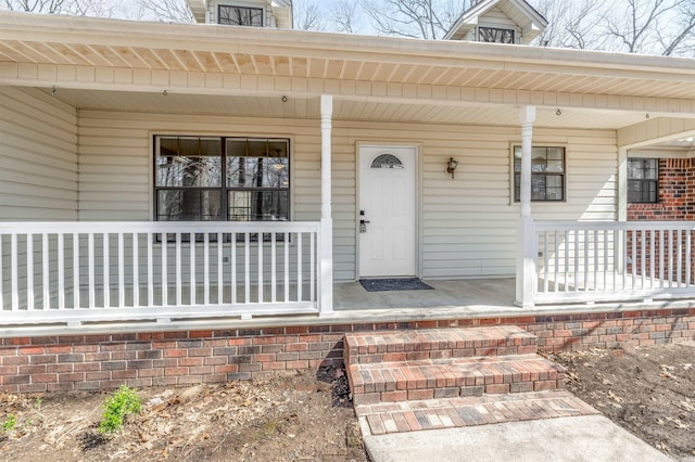 property entrance featuring covered porch