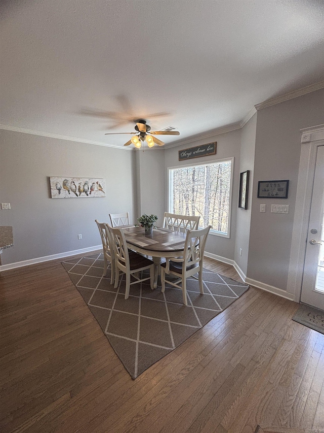 dining area with ceiling fan, baseboards, dark wood-style floors, and crown molding