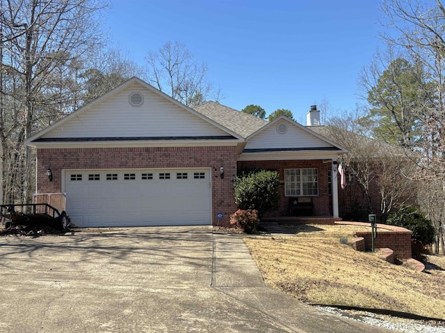 ranch-style home featuring brick siding, an attached garage, covered porch, a chimney, and driveway