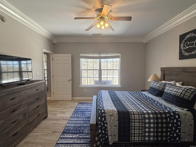 bedroom featuring visible vents, ornamental molding, light wood-style floors, baseboards, and ceiling fan