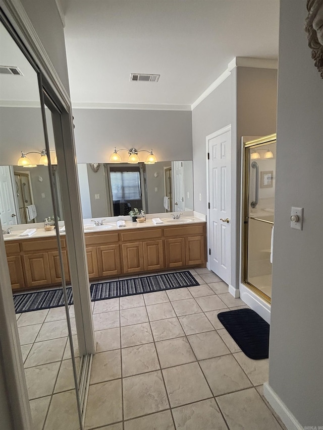 full bathroom with tile patterned flooring, visible vents, a stall shower, and crown molding