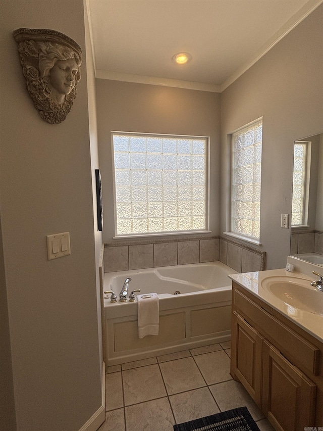 full bath featuring tile patterned floors, a tub with jets, vanity, and crown molding