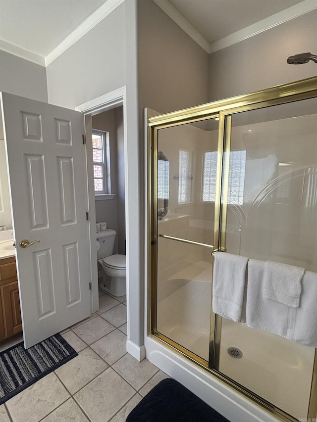 full bath with a shower stall, toilet, and crown molding