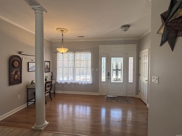 foyer featuring wood finished floors, baseboards, visible vents, decorative columns, and ornamental molding