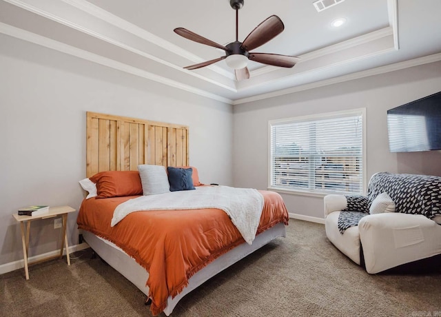 bedroom with a raised ceiling, carpet flooring, baseboards, and visible vents