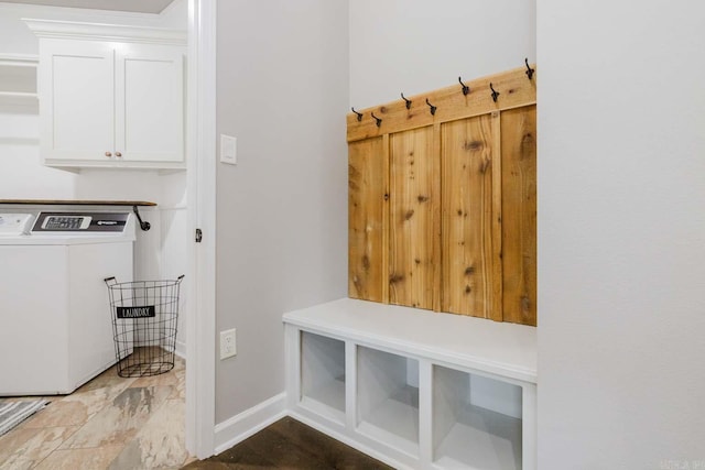 mudroom featuring baseboards and washer and clothes dryer