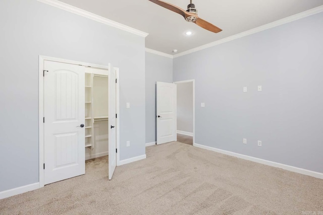 unfurnished bedroom featuring baseboards, ornamental molding, and carpet flooring