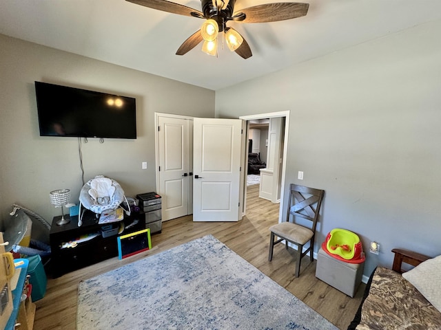 rec room featuring wood finished floors and ceiling fan