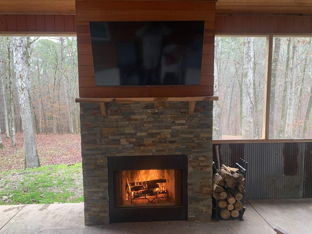 details with stone siding and an outdoor stone fireplace