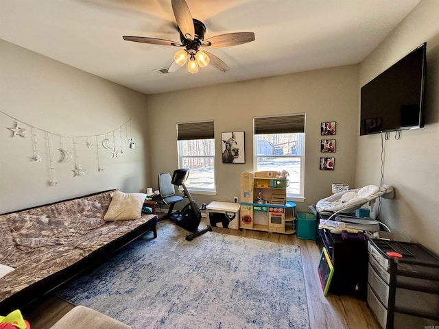 interior space with ceiling fan and wood finished floors