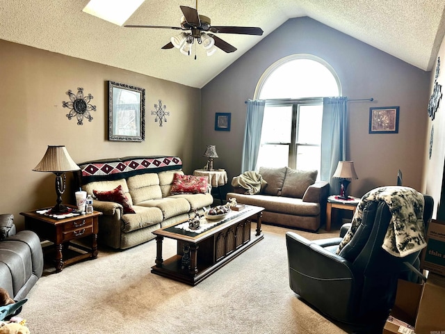 carpeted living room with a textured ceiling, a ceiling fan, and vaulted ceiling