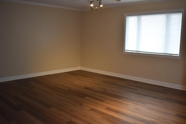 empty room with ceiling fan, crown molding, baseboards, and dark wood-style flooring