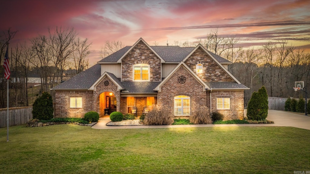 1713 Yorkshire Dr, Benton, AR 72019 - craftsman-style home featuring brick siding, roof with shingles, a front lawn, and fence