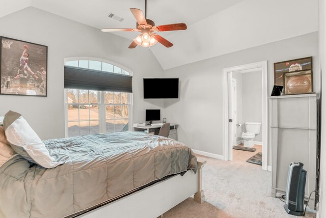 carpeted bedroom featuring a ceiling fan, visible vents, baseboards, ensuite bath, and lofted ceiling