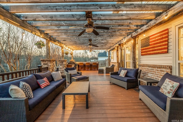 wooden terrace featuring ceiling fan, outdoor lounge area, and a pergola