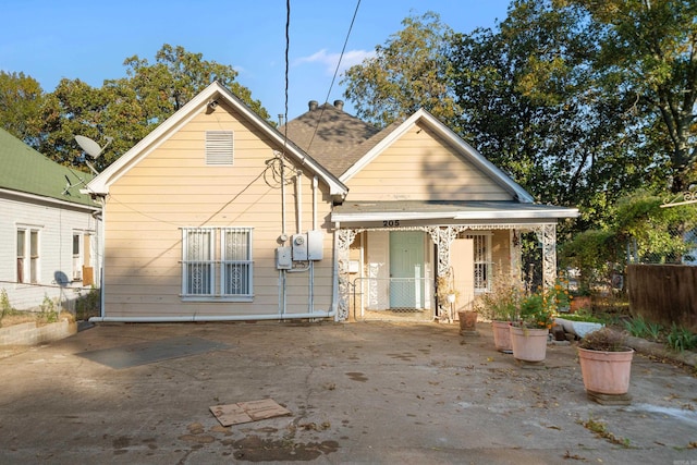 back of property featuring fence