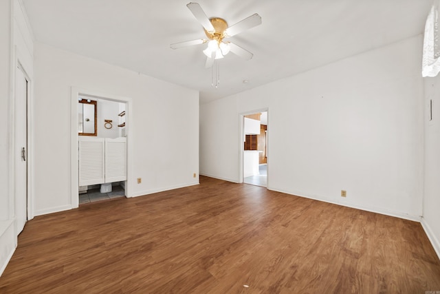 unfurnished bedroom with wood finished floors, baseboards, and ceiling fan