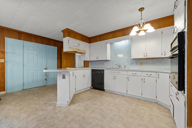 kitchen featuring light floors, black appliances, light countertops, and a sink