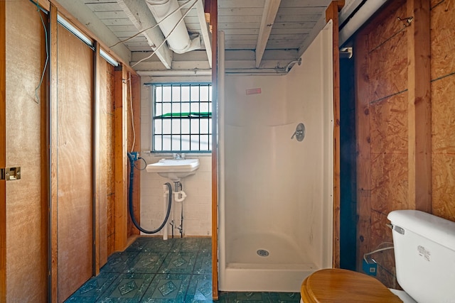 full bath with tile patterned floors, toilet, a stall shower, and wooden ceiling