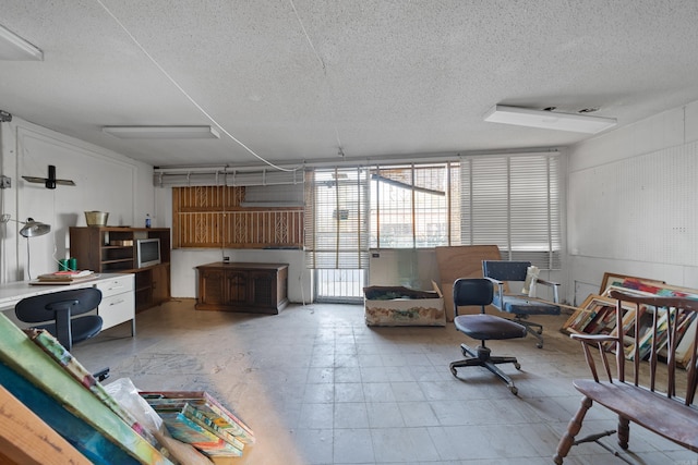 living area featuring a textured ceiling