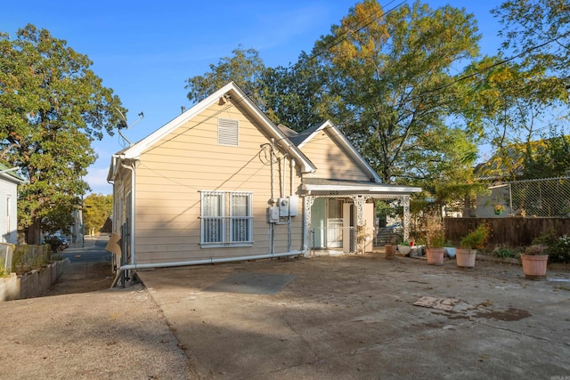 rear view of property with fence