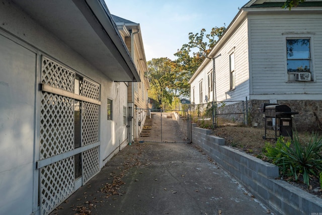 view of side of property with a gate and fence