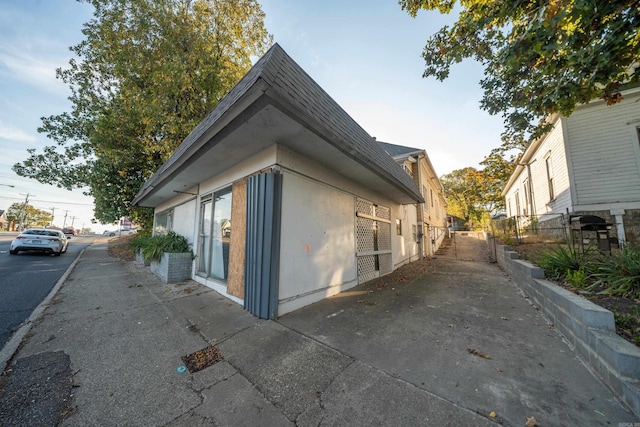 view of property exterior with fence