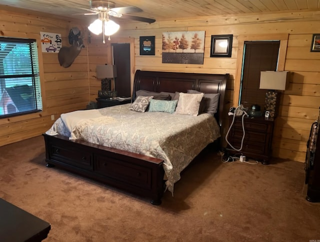 bedroom featuring wood ceiling, wood walls, and carpet floors