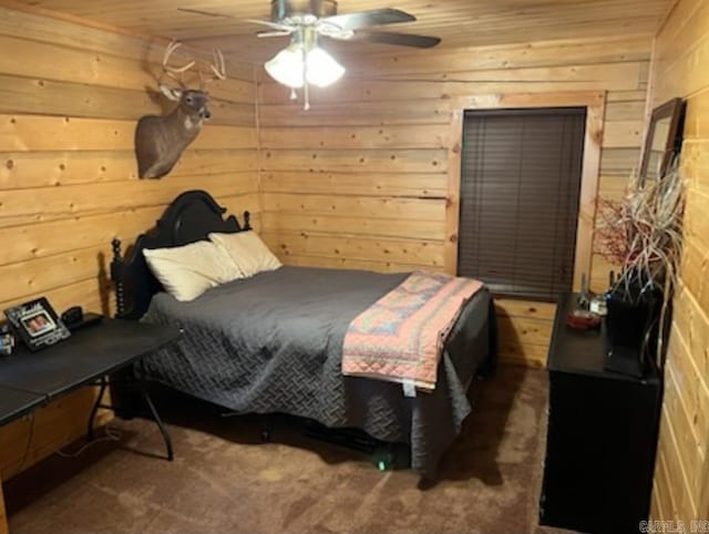 carpeted bedroom featuring wood ceiling, wood walls, and a ceiling fan