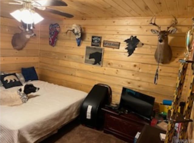 bedroom featuring wooden walls and wood ceiling