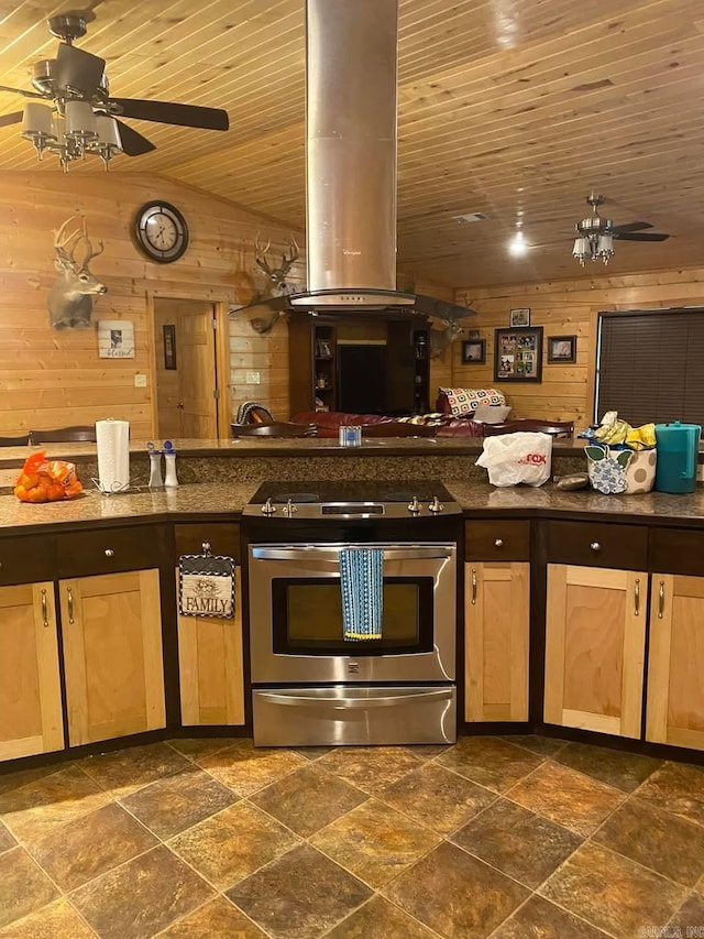 kitchen with range hood, wooden walls, wood ceiling, and stainless steel gas stove