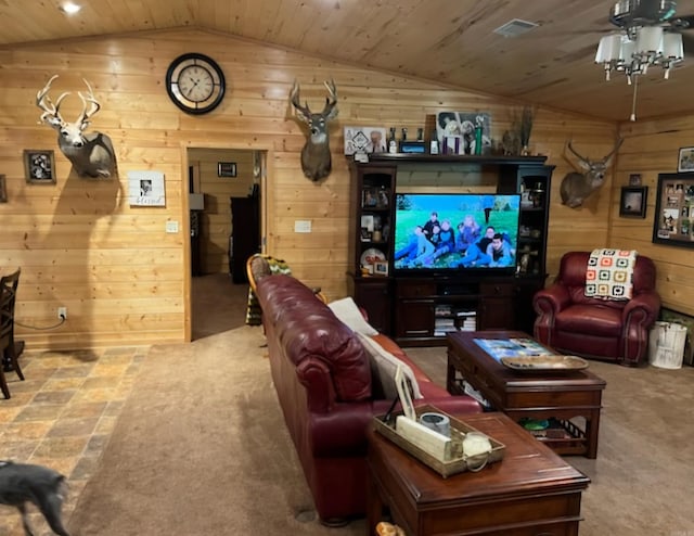 cinema featuring wooden walls, wood ceiling, a ceiling fan, and vaulted ceiling