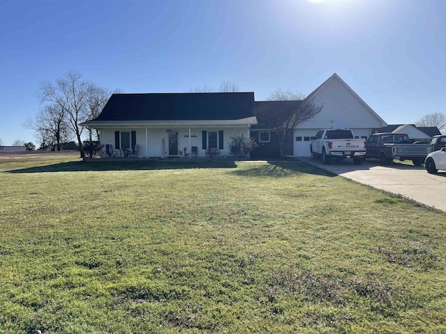 ranch-style house with driveway, an attached garage, covered porch, and a front lawn