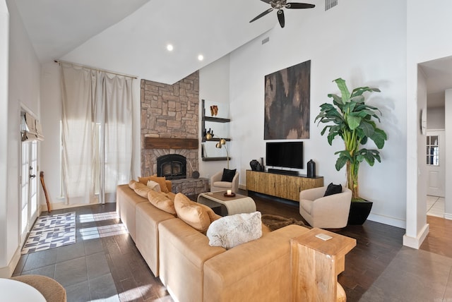 living room featuring baseboards, ceiling fan, a fireplace, wood finished floors, and high vaulted ceiling