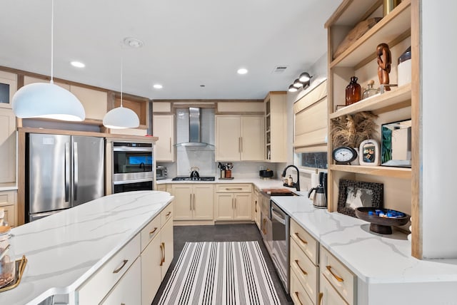 kitchen with visible vents, open shelves, a sink, stainless steel appliances, and wall chimney exhaust hood