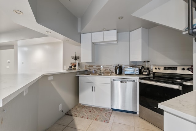 kitchen featuring white cabinetry, stainless steel appliances, and a sink