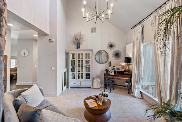 living area with visible vents, baseboards, light tile patterned floors, a high ceiling, and an inviting chandelier