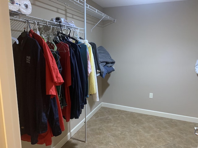 spacious closet featuring tile patterned flooring