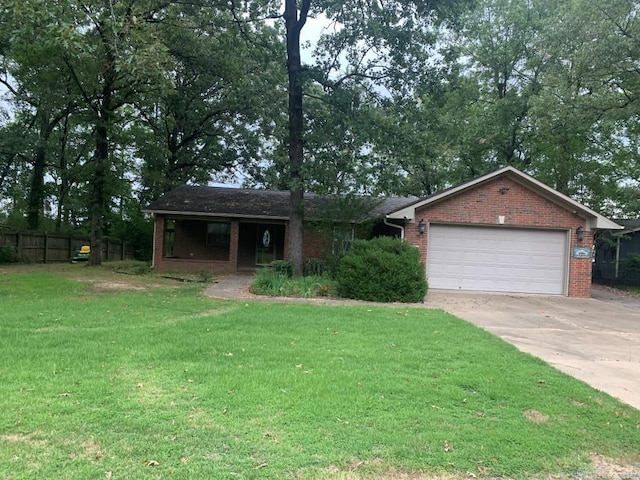 single story home featuring a front yard, an attached garage, brick siding, and driveway