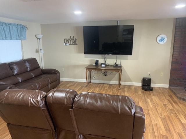 living area with recessed lighting, wood finished floors, and baseboards