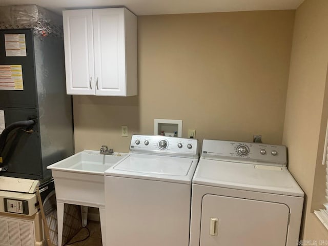 laundry room with cabinet space and separate washer and dryer