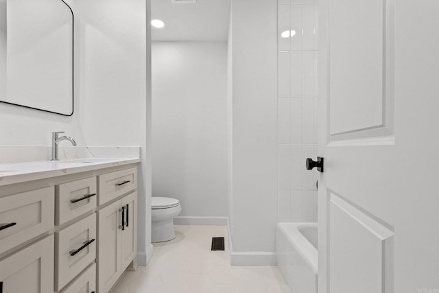 bathroom featuring visible vents, toilet, shower / washtub combination, baseboards, and vanity