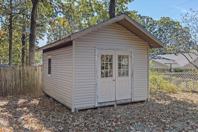 view of shed with fence