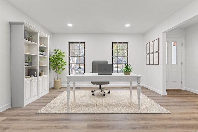 office area with recessed lighting, baseboards, and light wood finished floors