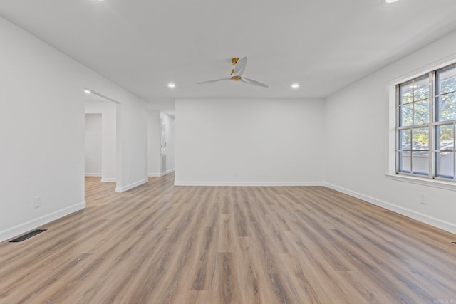 empty room with visible vents, recessed lighting, baseboards, and light wood-style floors