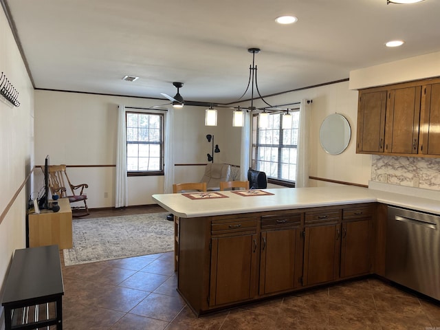 kitchen featuring a ceiling fan, a peninsula, crown molding, light countertops, and dishwasher