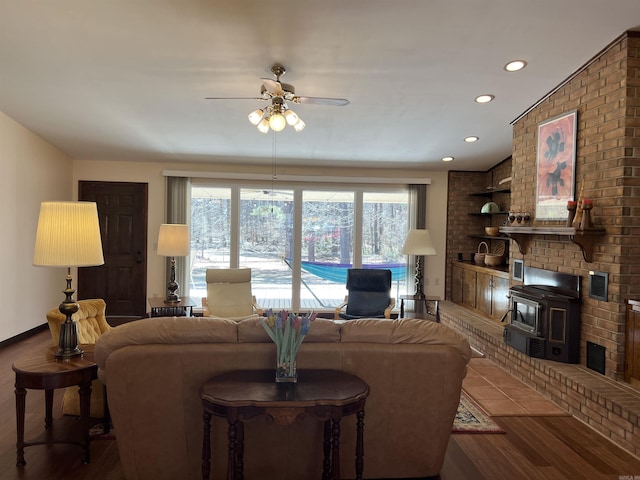 living room featuring recessed lighting, baseboards, ceiling fan, and wood finished floors